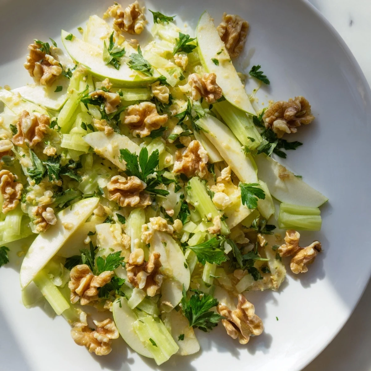 Apple and Celery Salad with Walnuts showcases crisp produce and toasted nuts on a rustic wooden table.