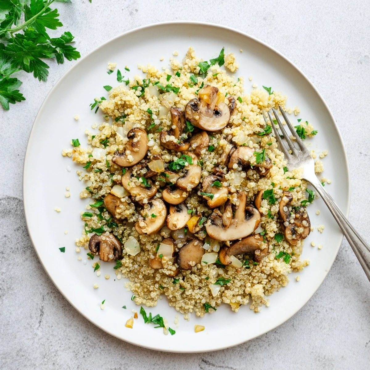 A bowl of warm Garlicky Mushroom Quinoa with lemon juice and thyme offers an earthy, satisfying dinner.