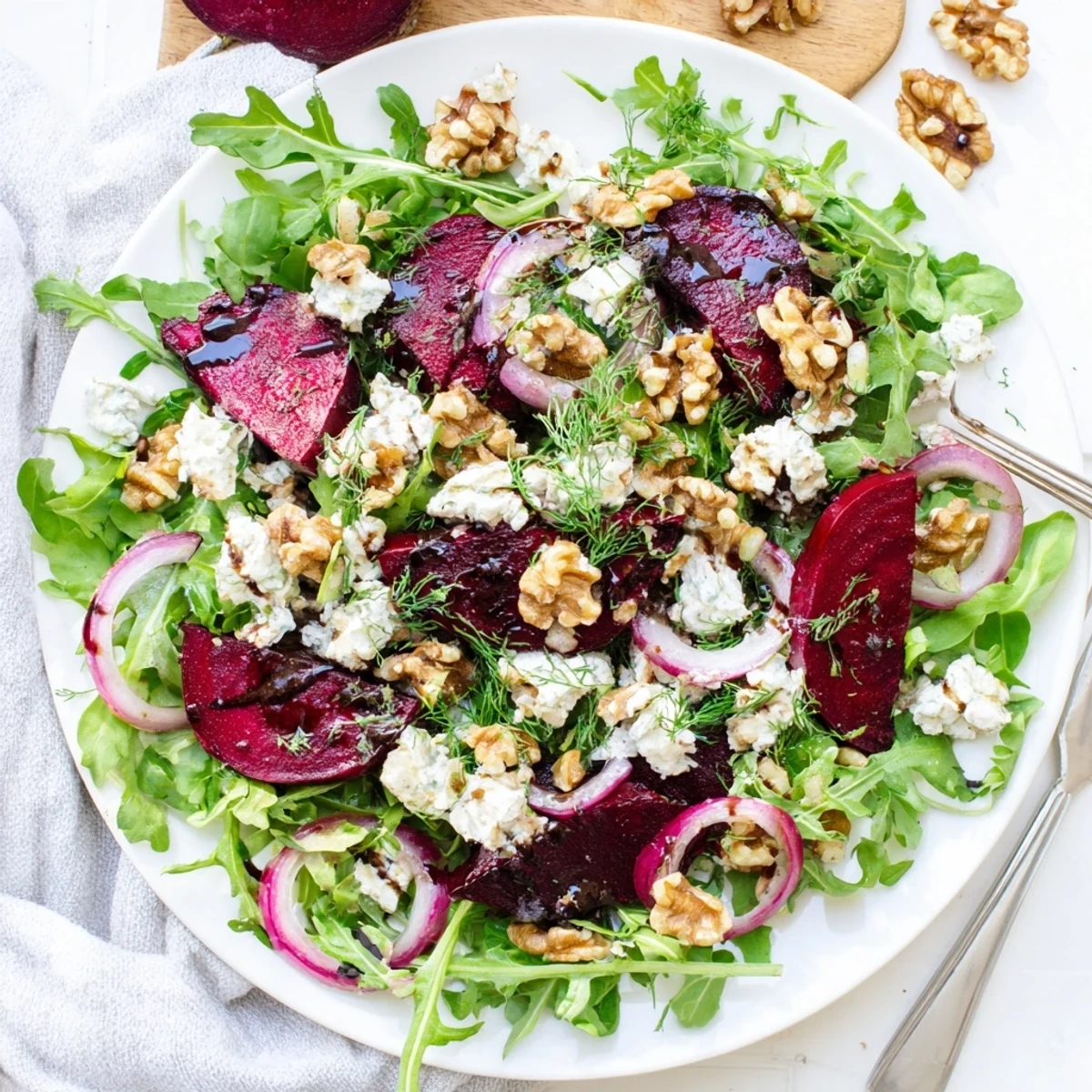 Colorful Ultimate Beet Salad with roasted beets, goat cheese, walnuts, and fresh greens