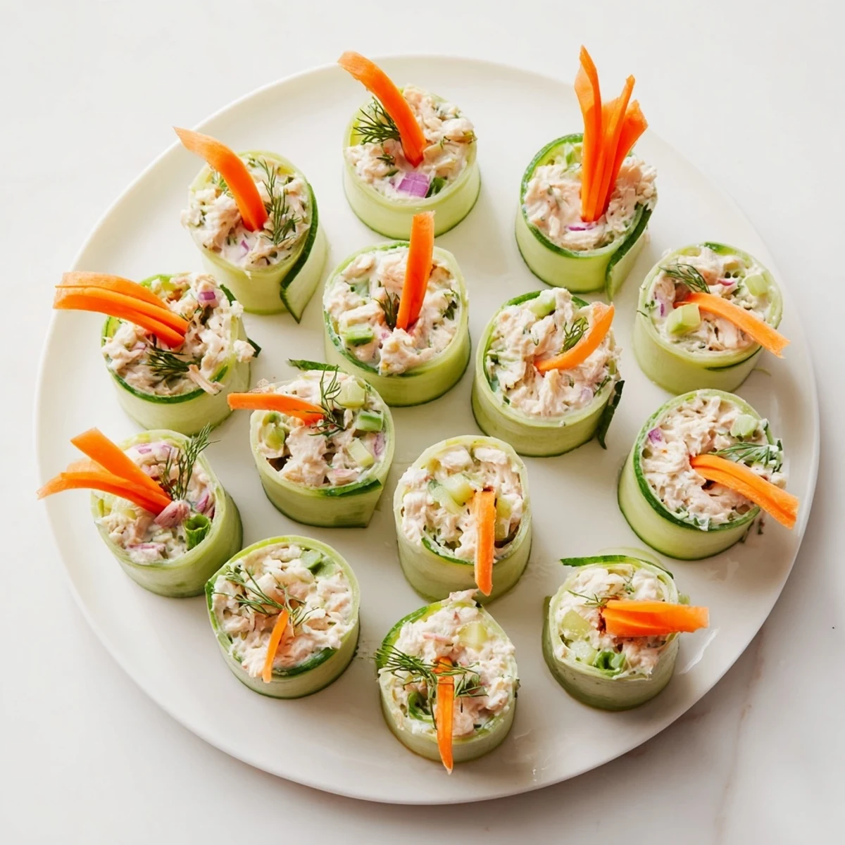 Crisp cucumber slices hold savory chicken salad filling in these easy roll ups.