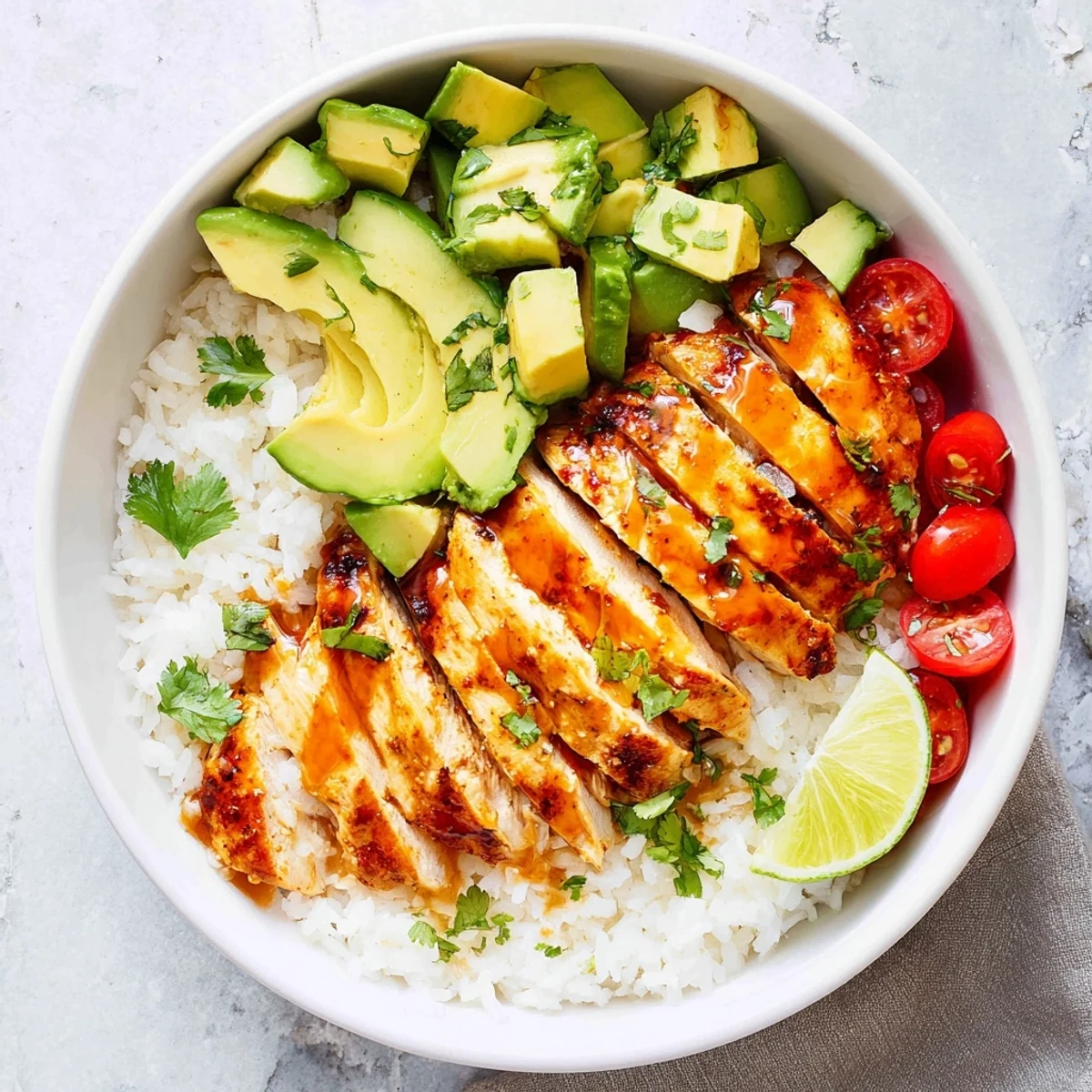 Honey lime chicken avocado rice stack showcasing tender sliced chicken atop fluffy white rice with creamy avocado layers