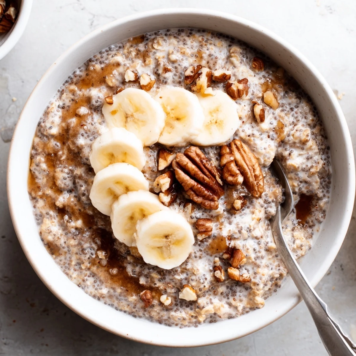 Creamy Brown Sugar Coffee Overnight Oats topped with sliced banana and nuts
