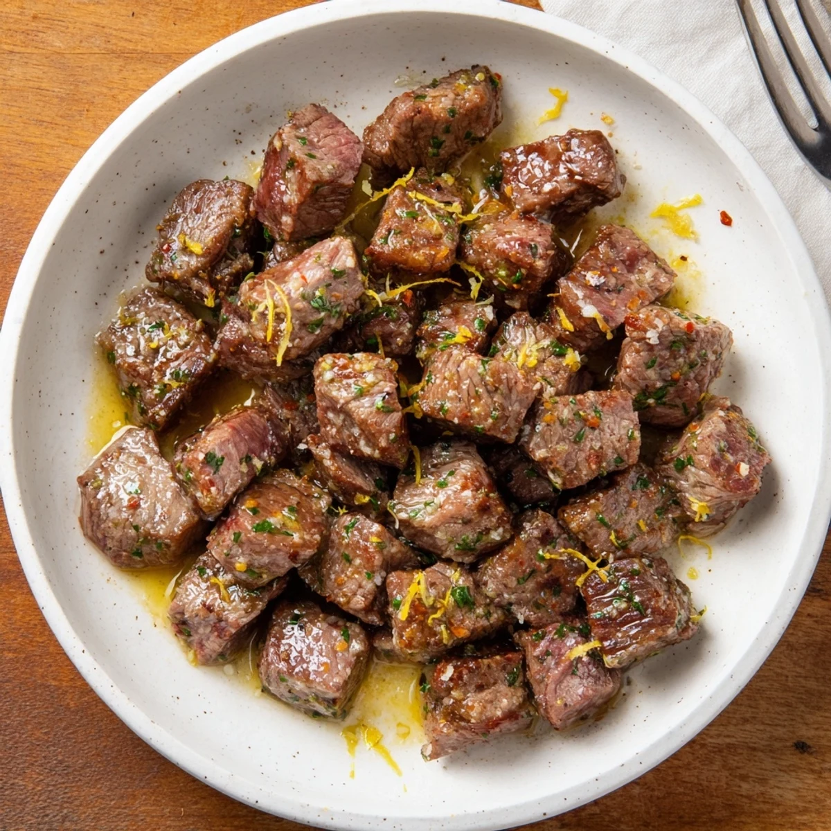 Seared Cowboy Butter Steak Bites steaming, browned edges, lemon zest brightness  