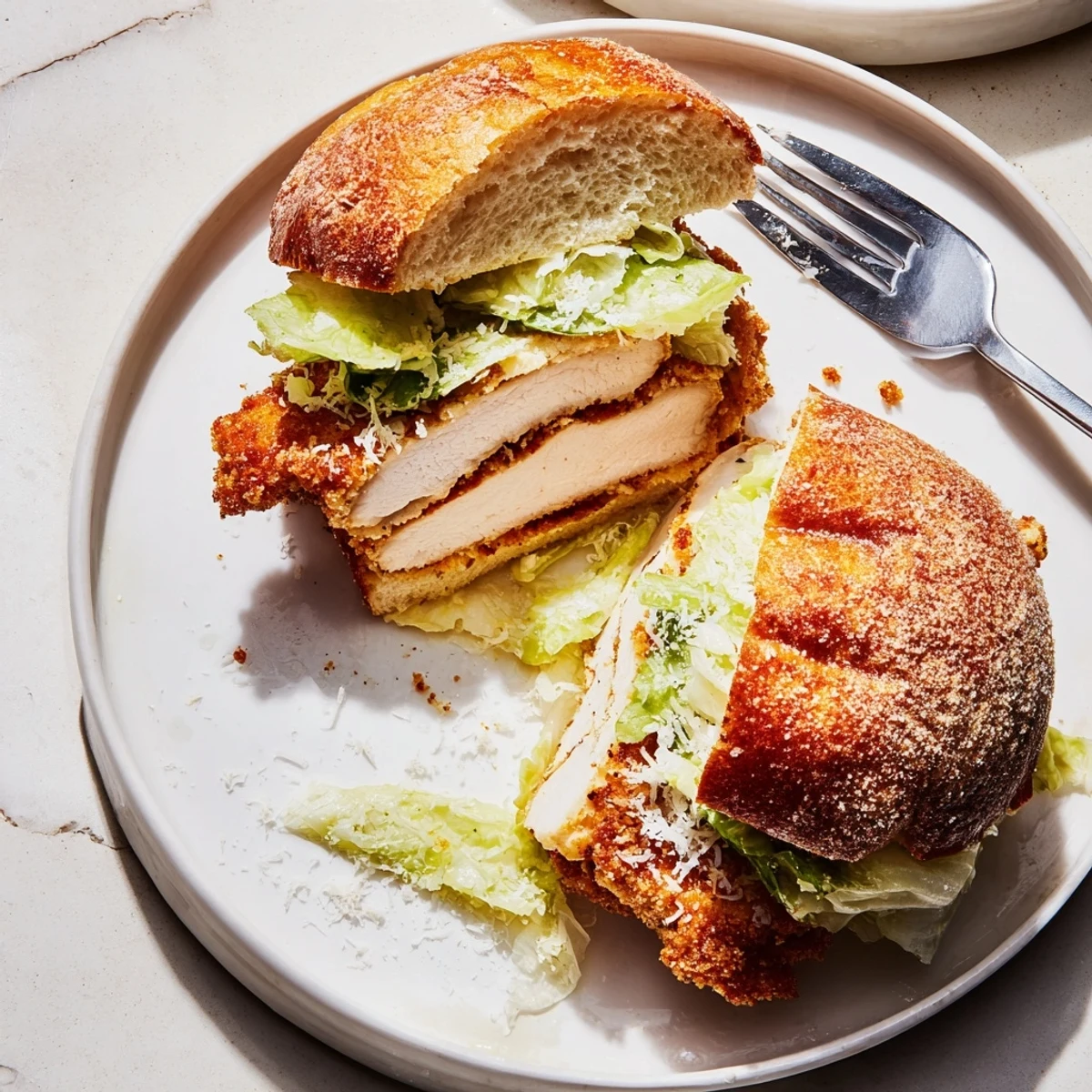 Pan-fried Crispy Chicken Caesar Sandwich Recipe served immediately with tangy lemon wedge