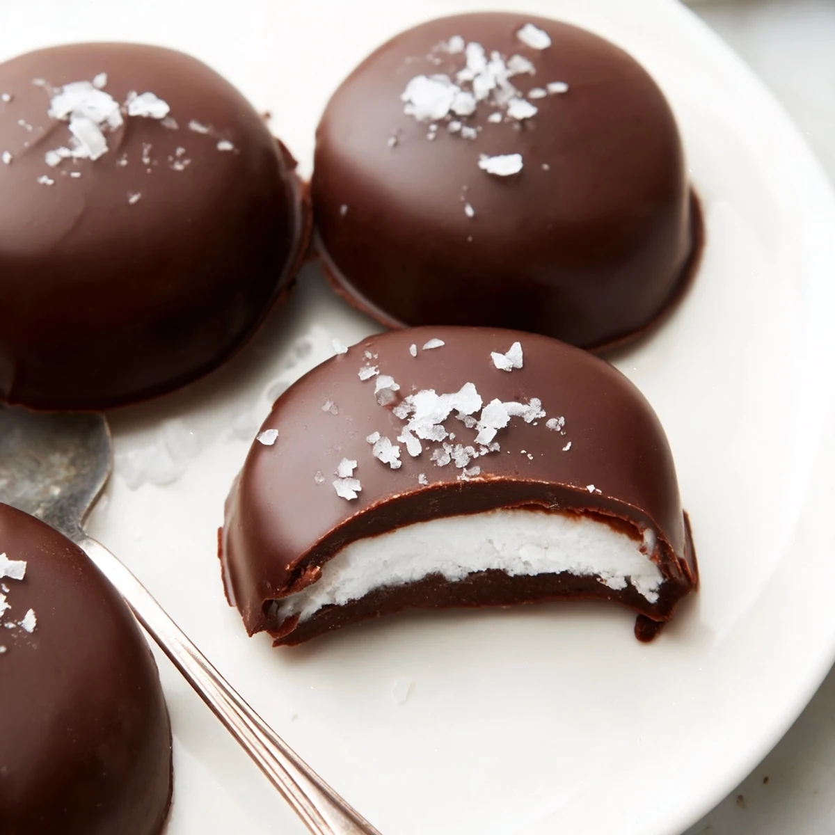 Peppermint Patties nestled in a gift box, sprinkled with flaky sea salt