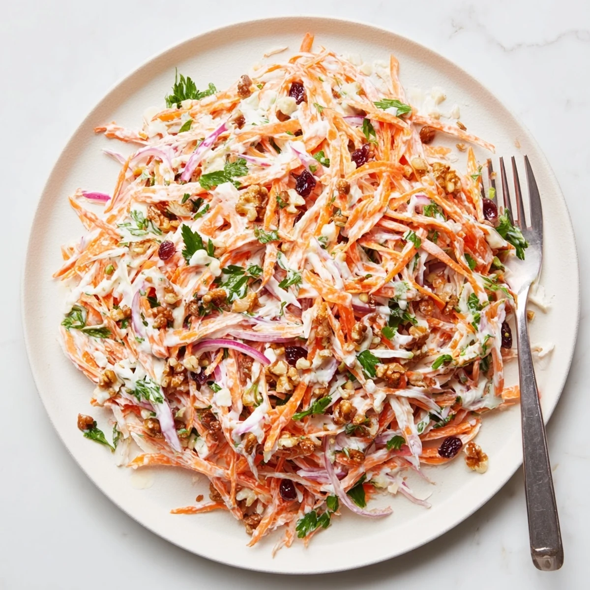 Colorful apple carrot slaw recipe featuring crunchy vegetables and honey yogurt glaze