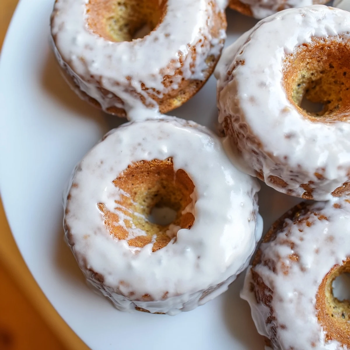 Batch of moist banana bread donuts fresh from the oven with warm spiced aroma