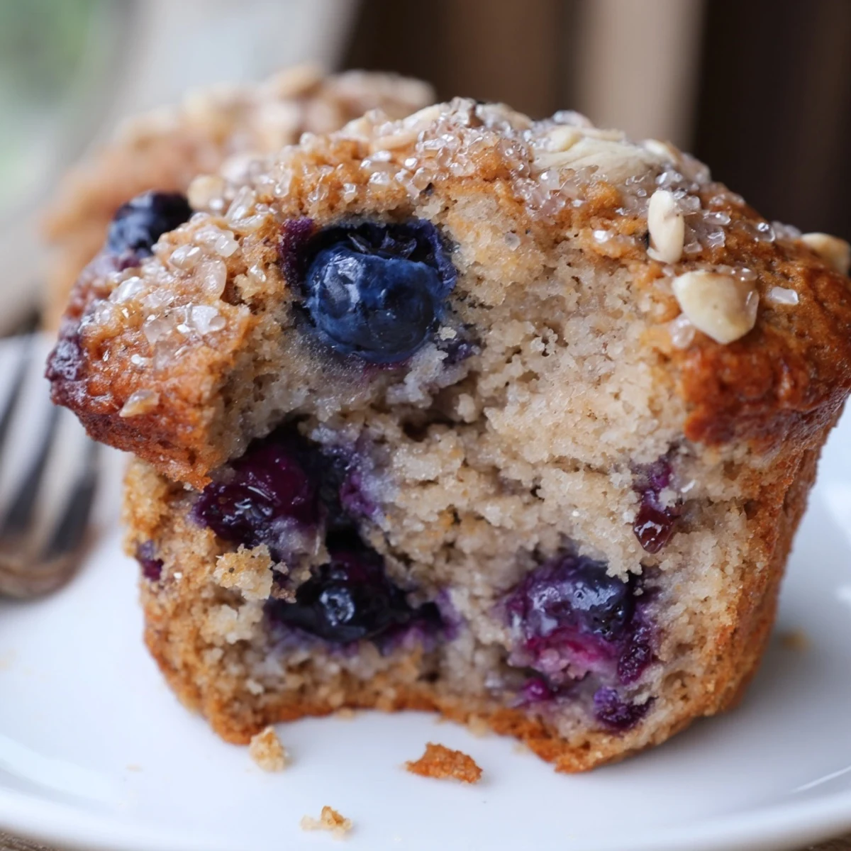 Freshly baked Blueberry Banana Muffins with coarse sugar sparkle, perfect breakfast snack