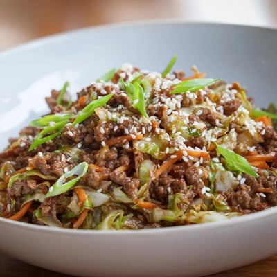 Sesame-topped keto egg roll in a bowl served in a warm deep dish